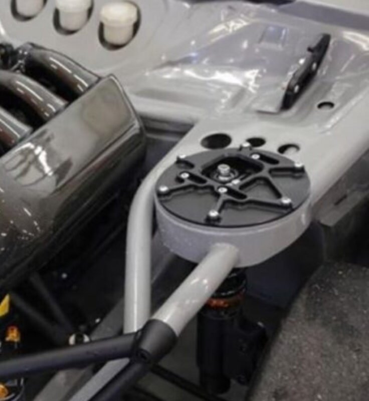 Race car rear suspension and top mount detail – NP Parts custom suspension component installation