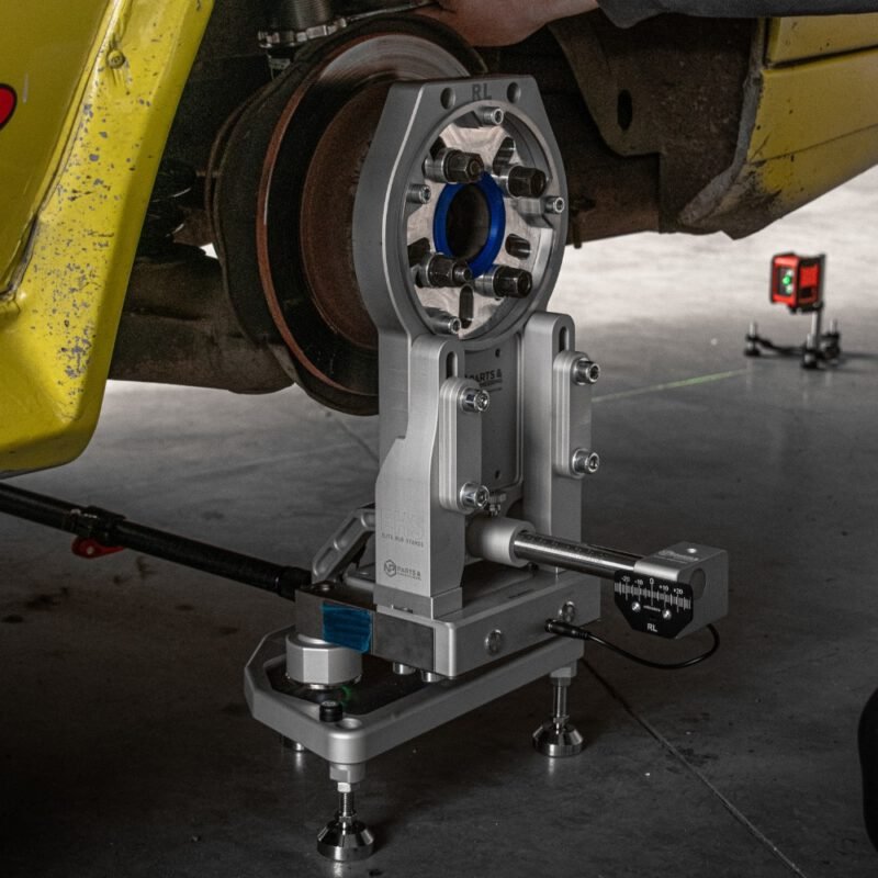 NP Elite Hub Stand mounted on rally car wheel hub – hub stand with laser alignment and load cell sensor in use