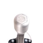 Round shifter knob in raw uncoated 6082 aluminium alloy with NP Parts logo, showing natural machined finish, for NP Parts short shifters from 2024