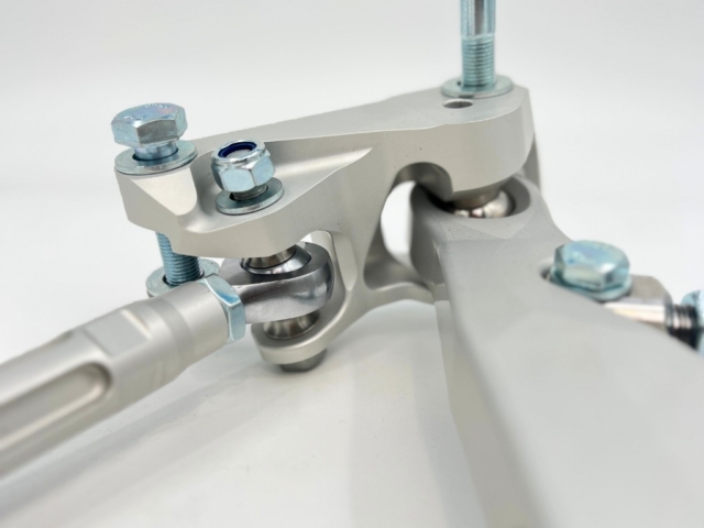 Close-up of the billet chassis bracket and rod ends used in the BMW Billet Front Suspension Kit