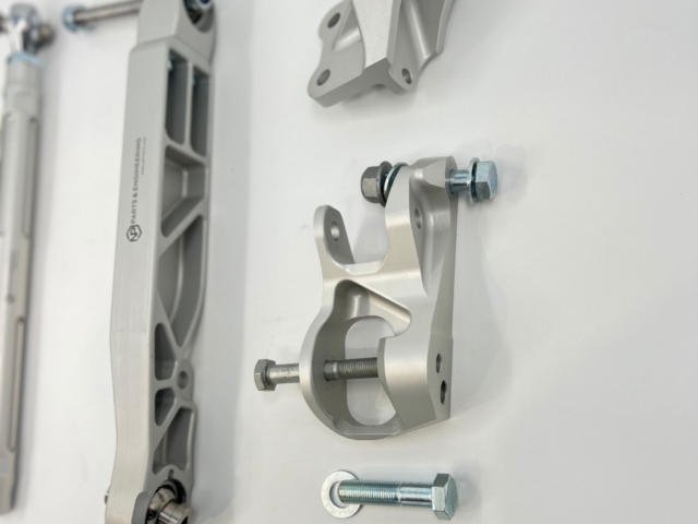 Parts included with the BMW Billet Front Suspension Kit: billet arm, two chassis brackets and mounting bolts