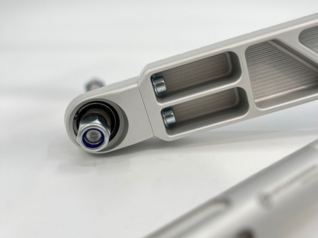 Motorsport spherical bearing pressed into the billet control arm of the BMW Billet Front Suspension Kit