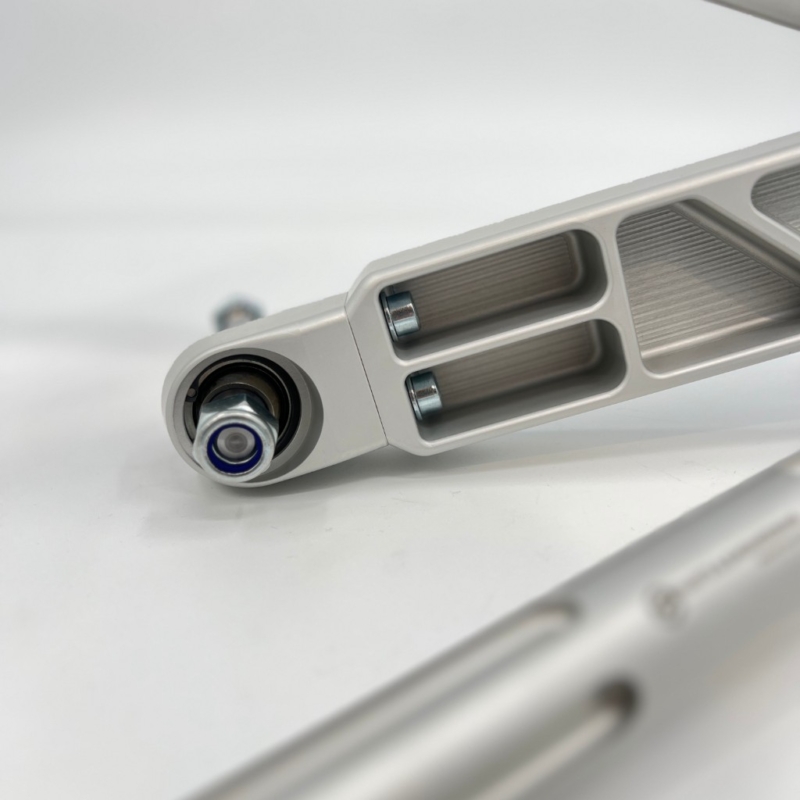 NP Parts CNC-machined billet front control arm with motorsport spherical bearing for the BMW E46 Compact race car