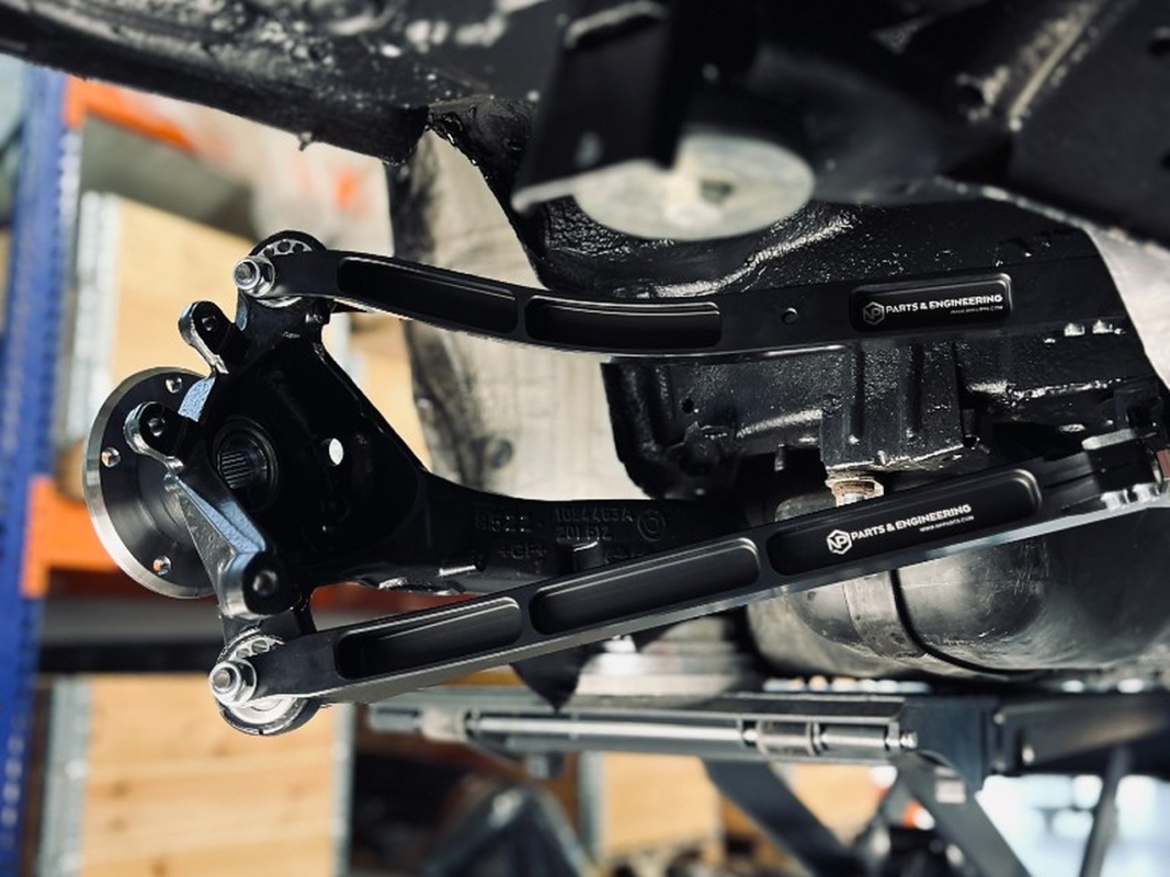 NP Parts CNC-machined 6082-T6 billet rear control arms installed on the BMW E46 Compact race car